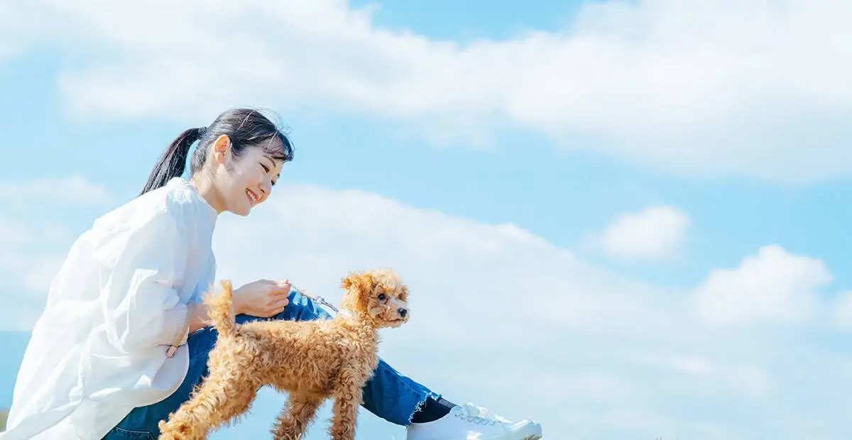 Happy pet owner and pet enjoying life together